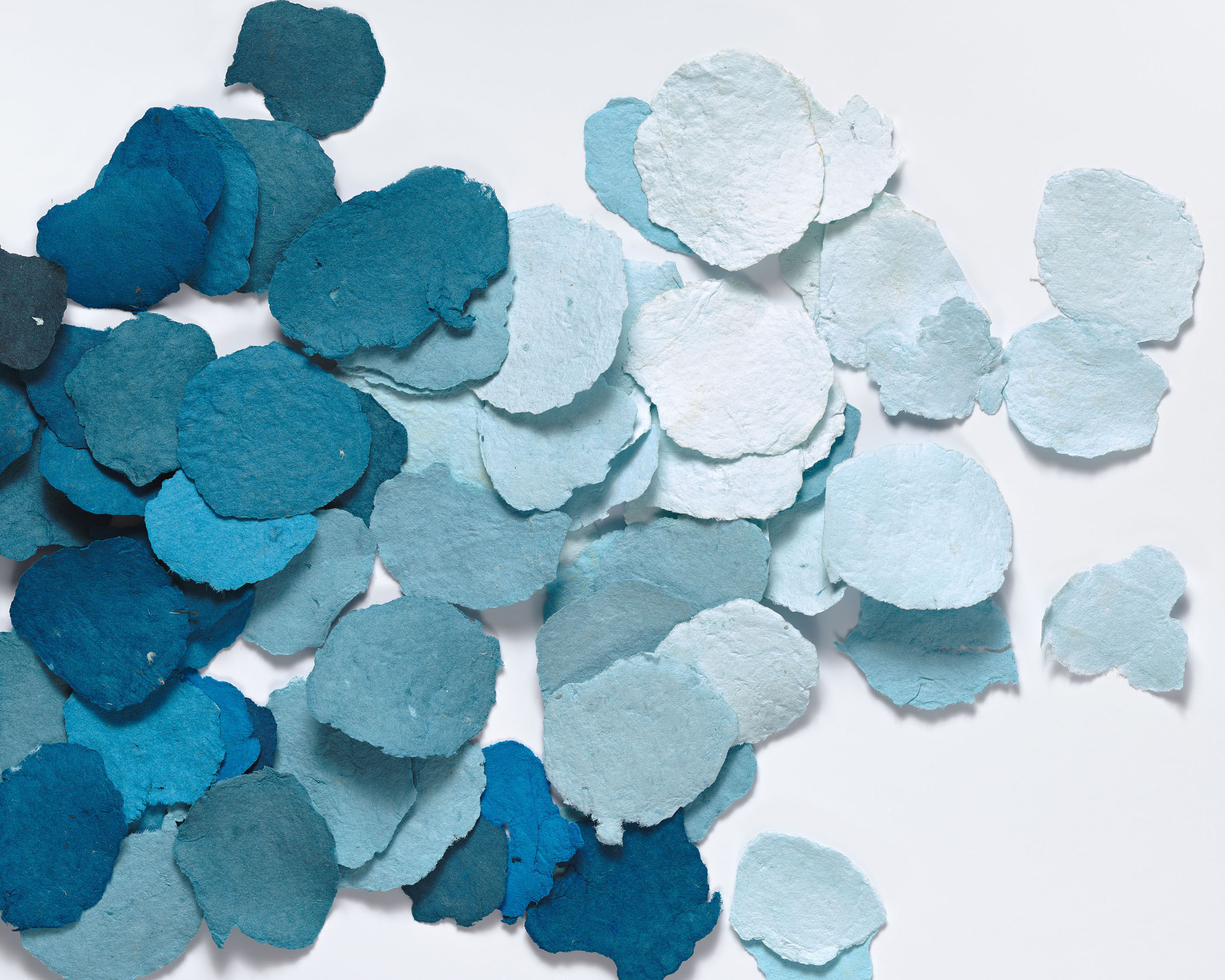 Samples of pigmented handmade cotton paper in shades of blue