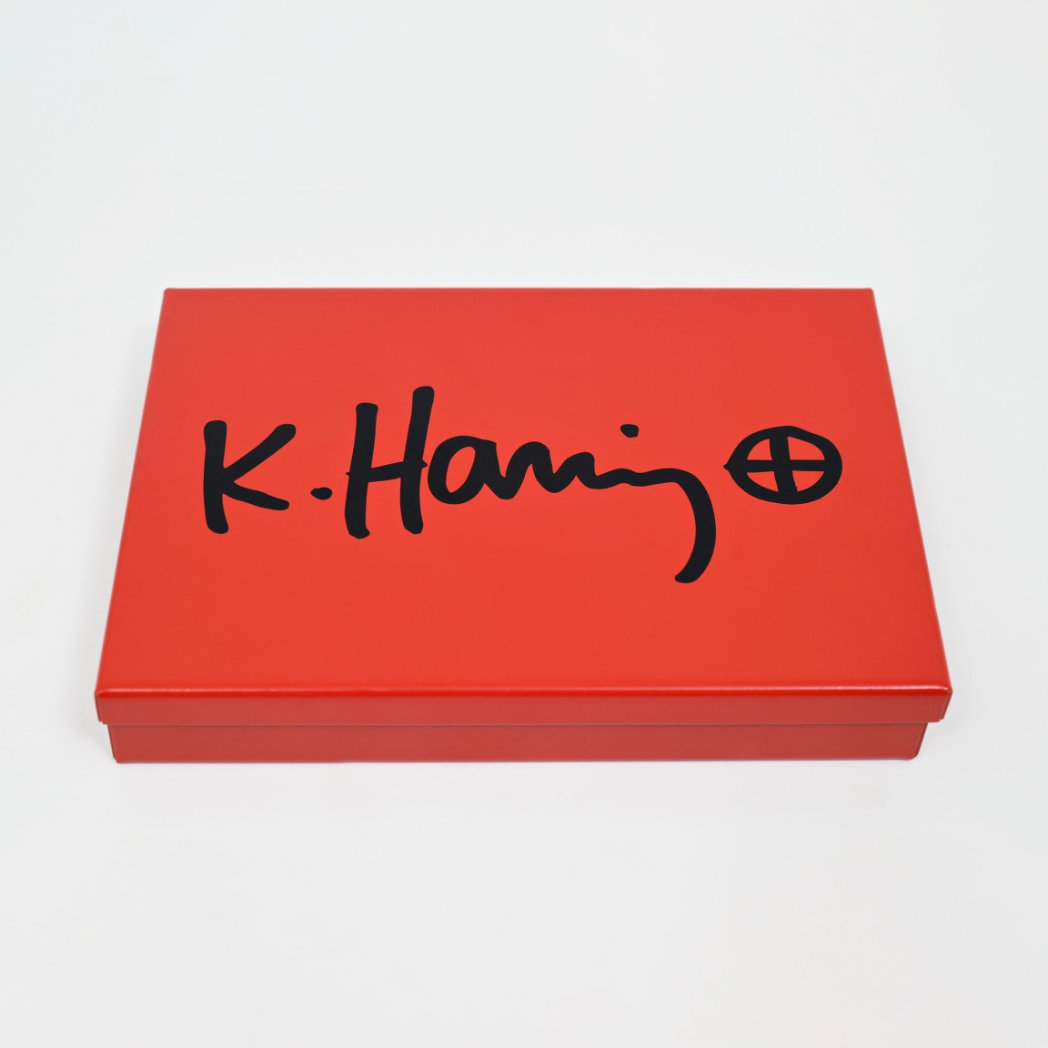 "Untitled (baby pin)" (1989) by Keith Haring