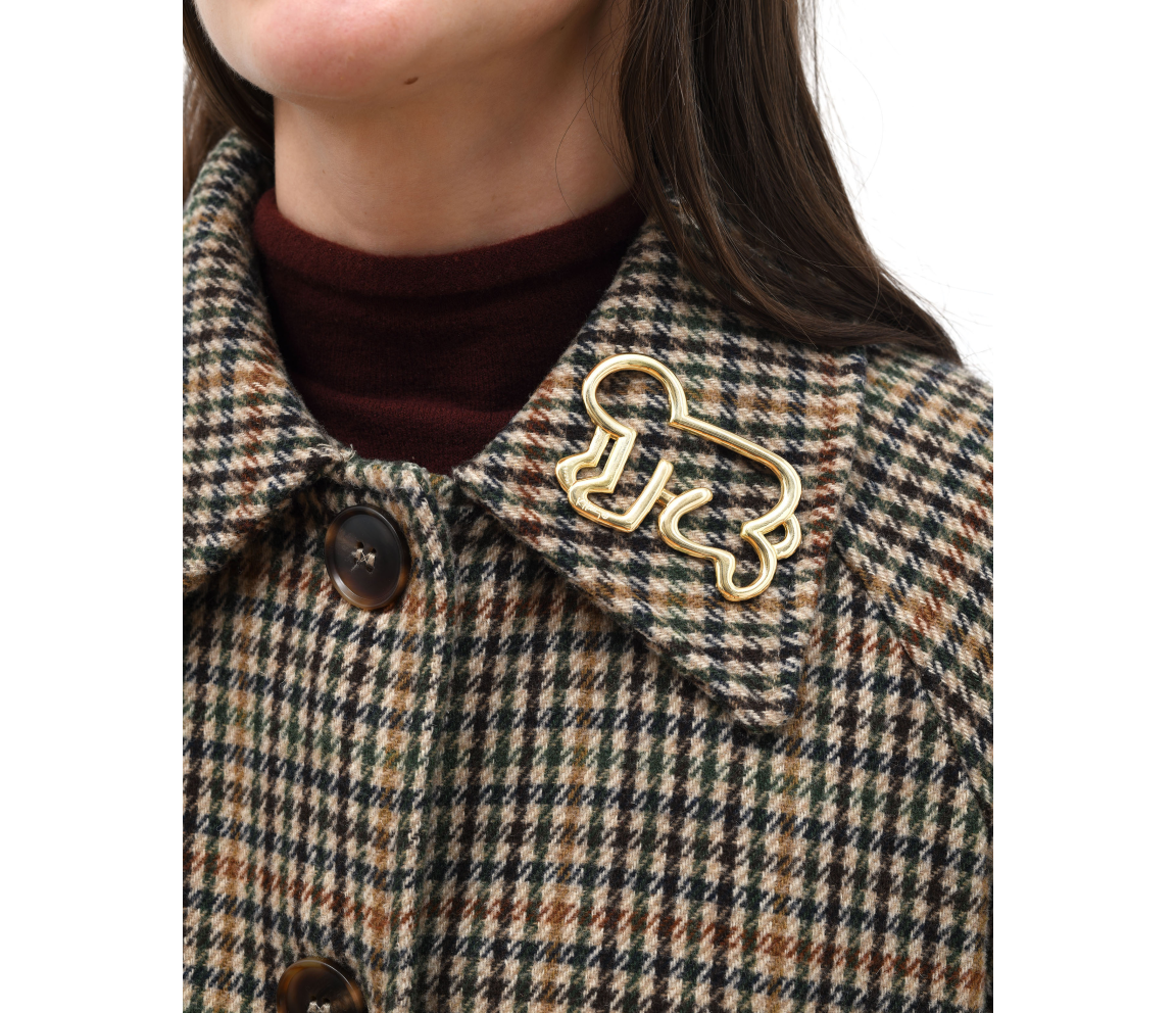 "Untitled (baby pin)" (1989) by Keith Haring